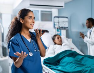 Doctor at hospital using walkie talkie app to notify the entire care team